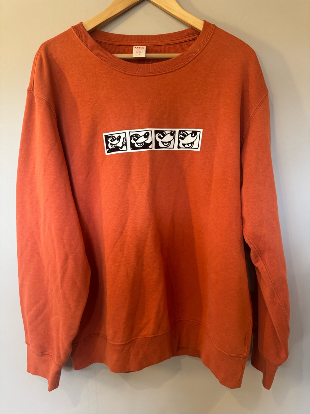 Disney Orange Crewneck Sweatshirt with Black-and-White Character Panels
